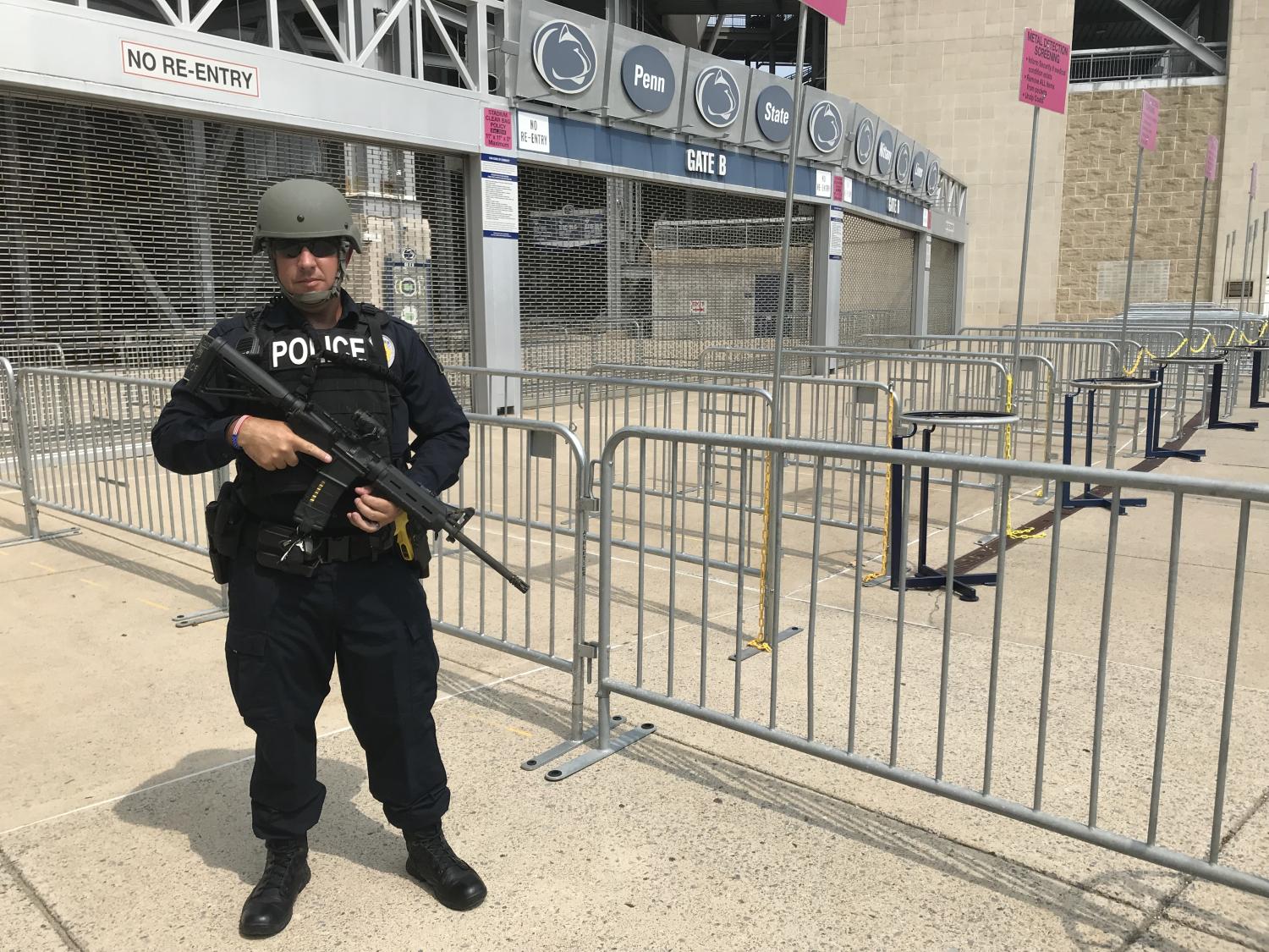 Penn State University Police Officer Mike Baker outfitted in tactical gear outside Beaver Stadium.