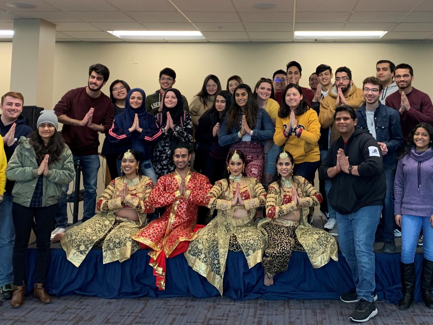 group of students and Indian dancers