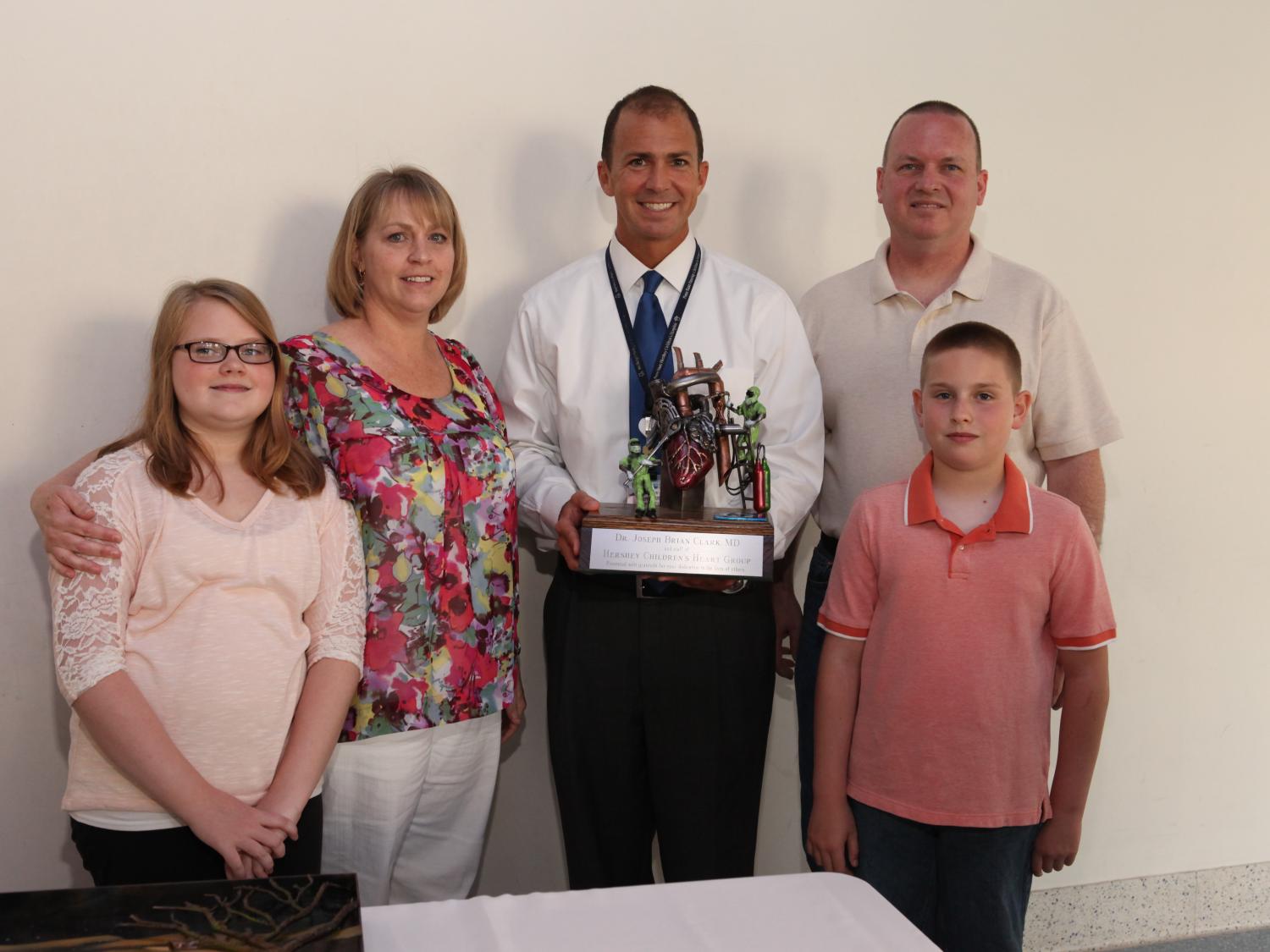 Murphy family presents sculpture to Dr. Brian Clark, Penn State Hershey Children's Heart Group