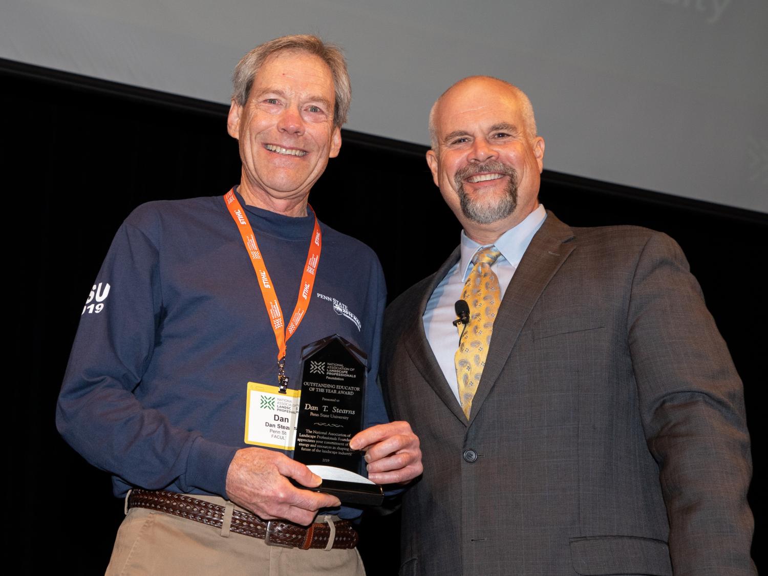 Dan Stearns receives award with board member