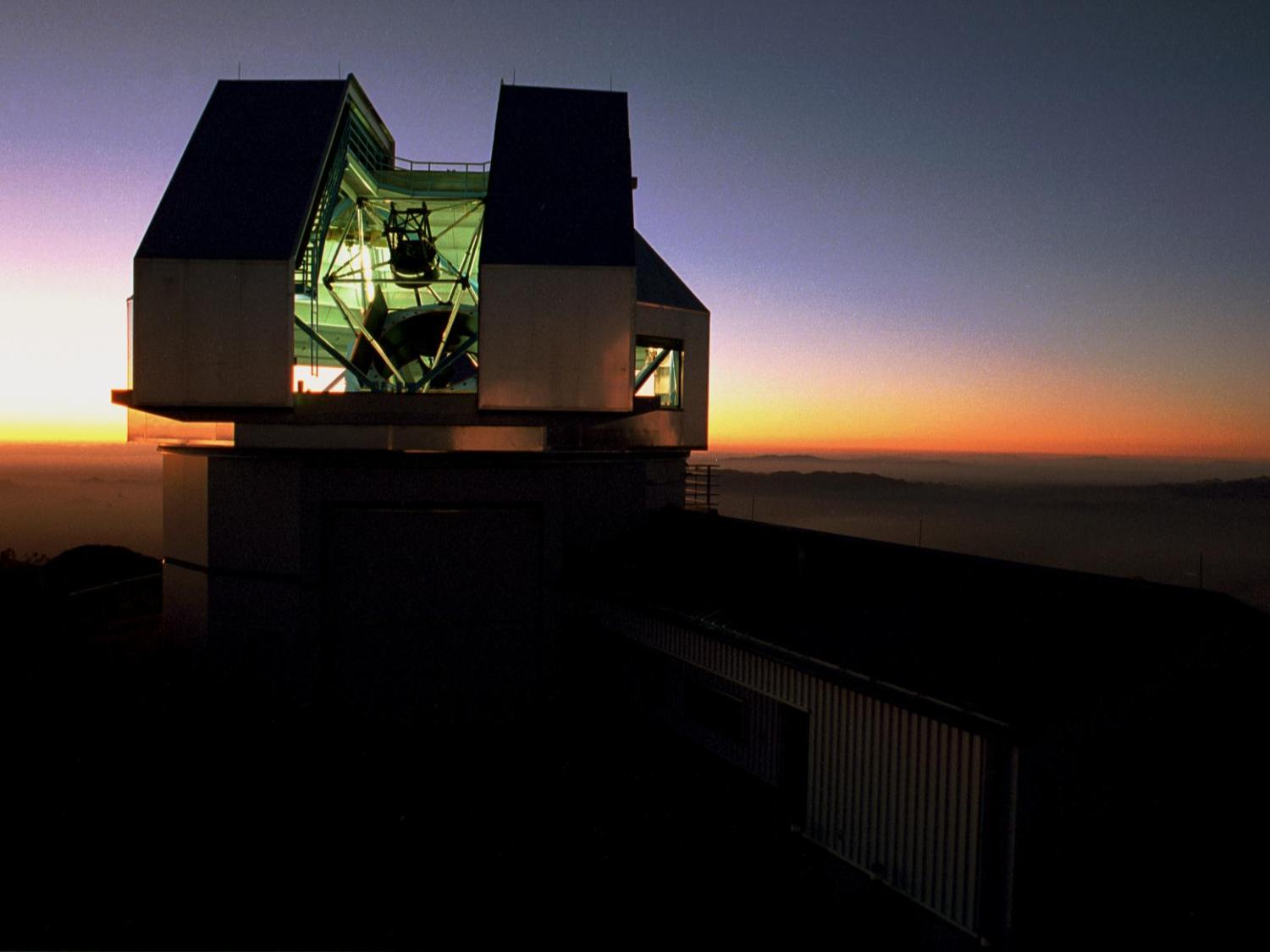 The WIYN telescope building at sunset.