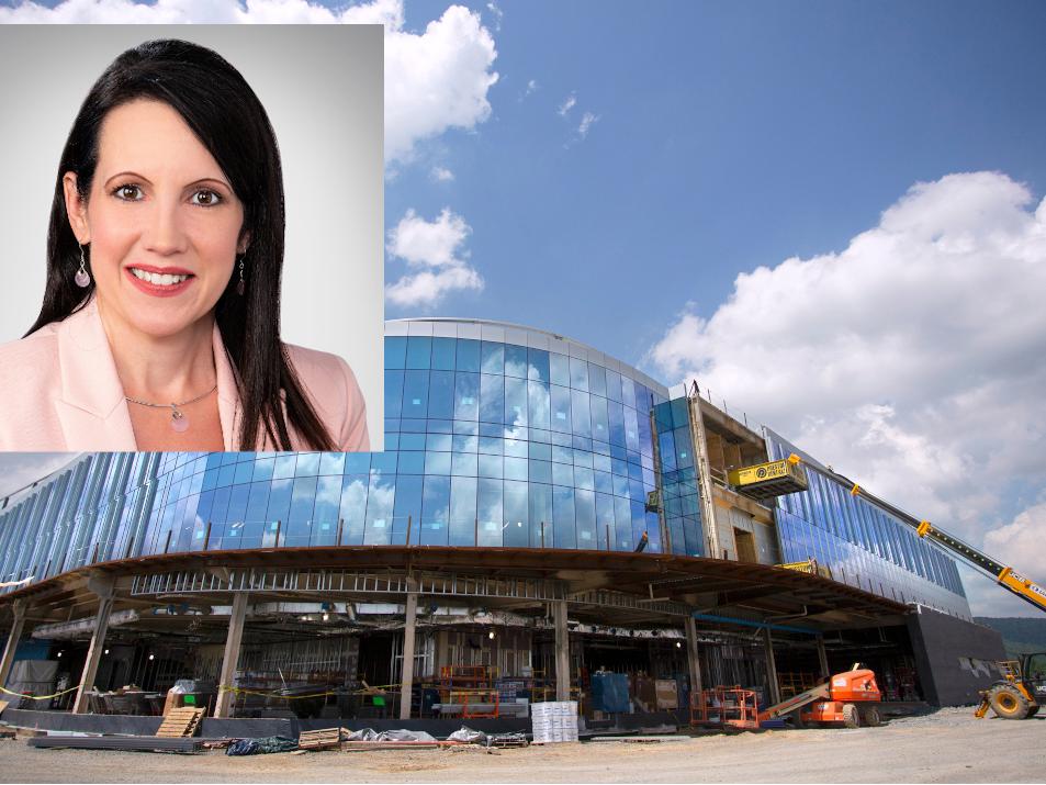 A headshot of a woman overlaid on a photo of a hospital
