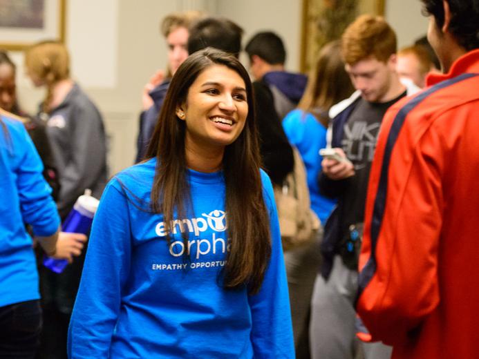 Neha Gupta, winner of the children's peace prize and founder of Empower Orphans, talks with a committee member.