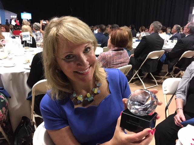 Nichola Gutgold holding a plaque