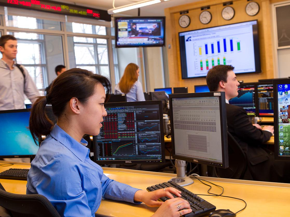 Emily Zheng reviews financial information in the Smeal College Trading Room.