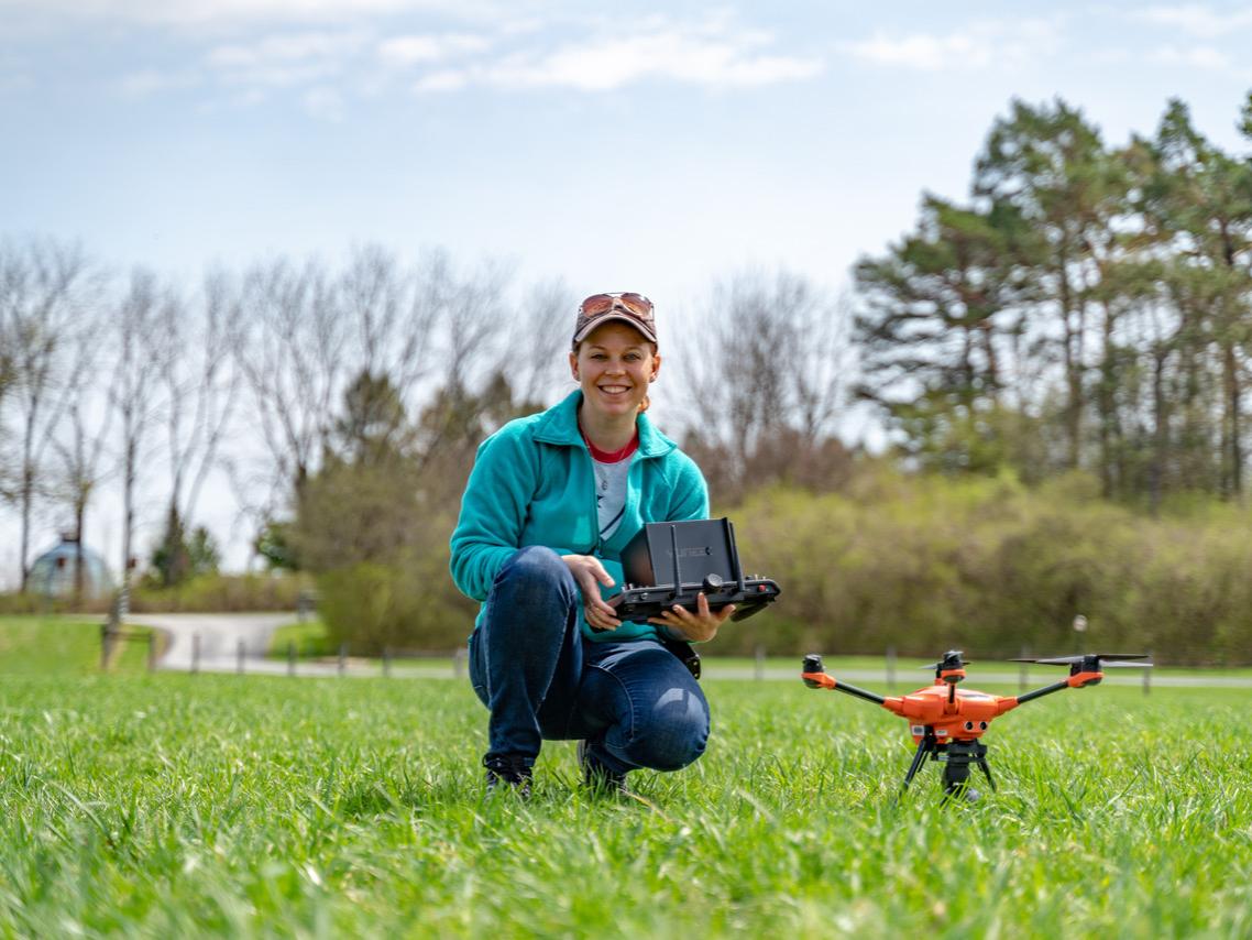 Courtney Jackson, a Ph.D. candidate in Cervone’s lab at Penn State, prepares to take thermal measurements via drone.