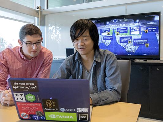 Sean Parsons and Yuya Ong review lessons plans for Nittany Data Labs.