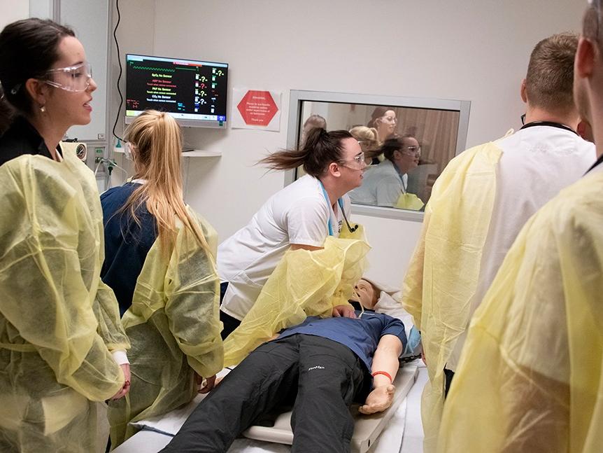 Students L-R  Morgan Dewitt, Jordan Pascoe, Caitlyn Stashick, Lucas Klorczyk, and Jonathan Klorczyk treat “Harry,” a simulated coded patient.