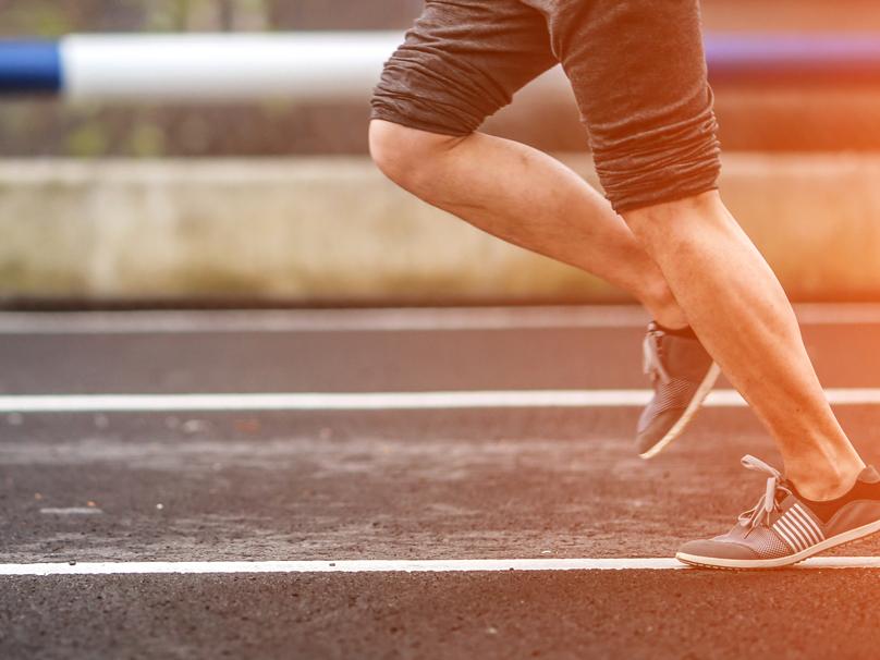 Man running on track.