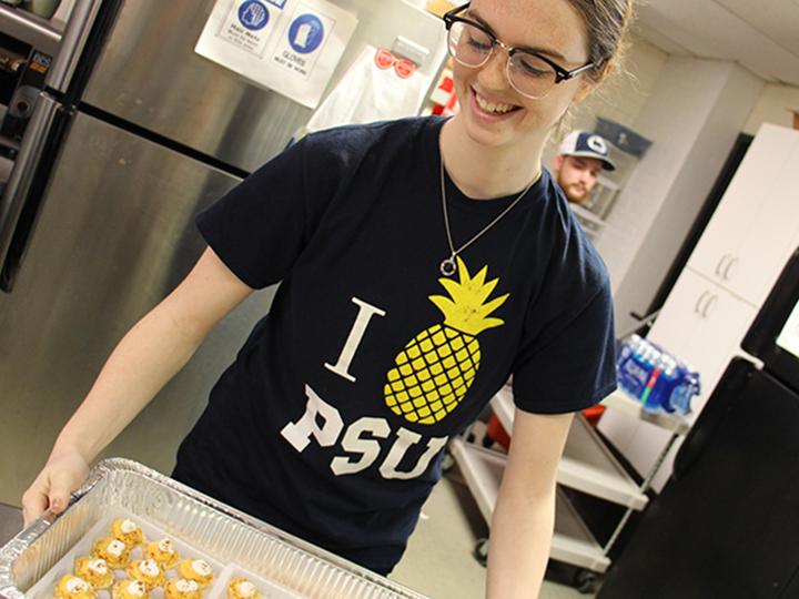 Student preparing food at Opportunity House