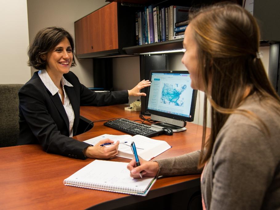 A professor works with a student in the Penn State Behrend MBA program.