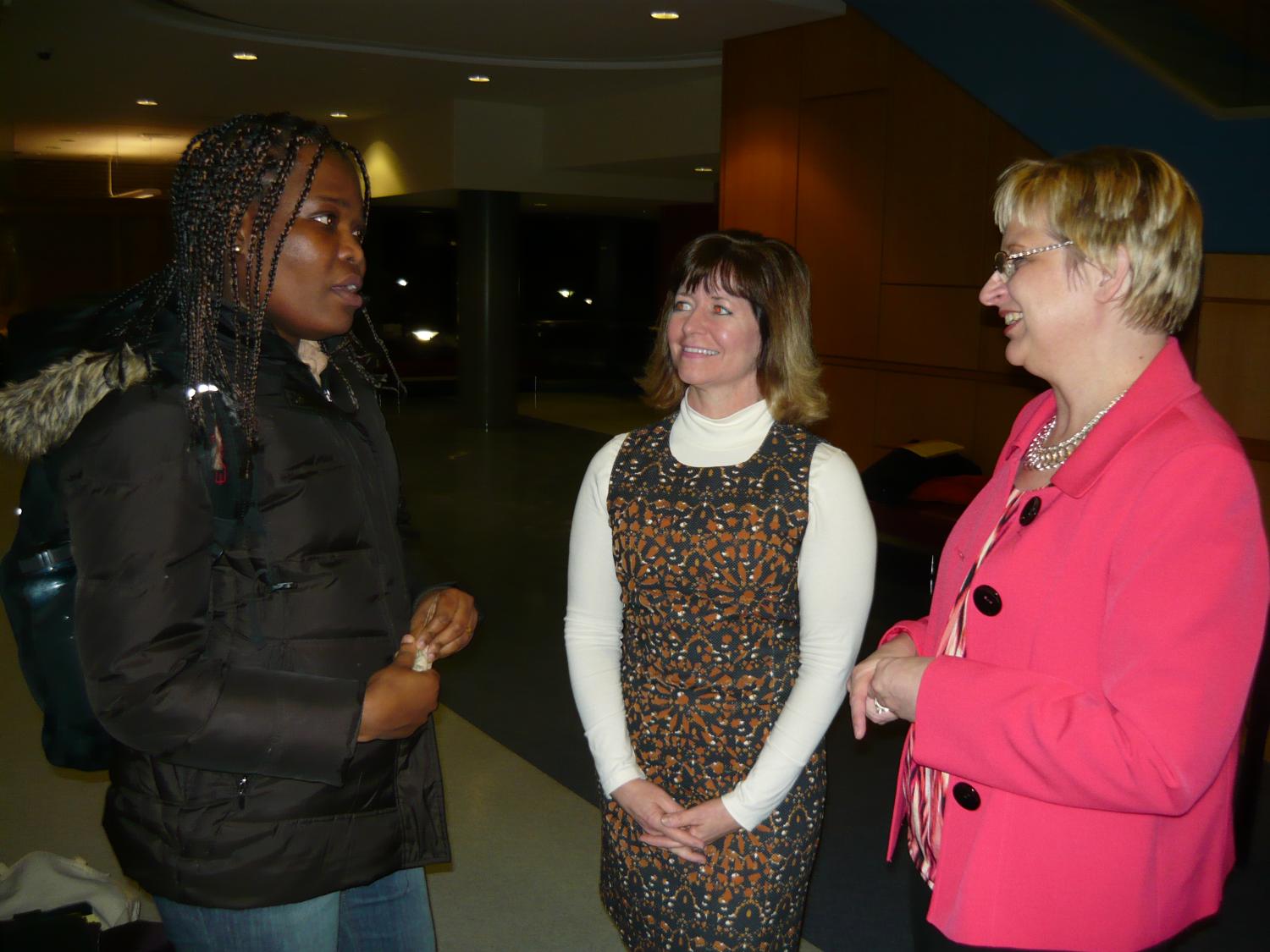  A graduate student poses questions to two of the Health Care Literacy 101 workshop presenters.