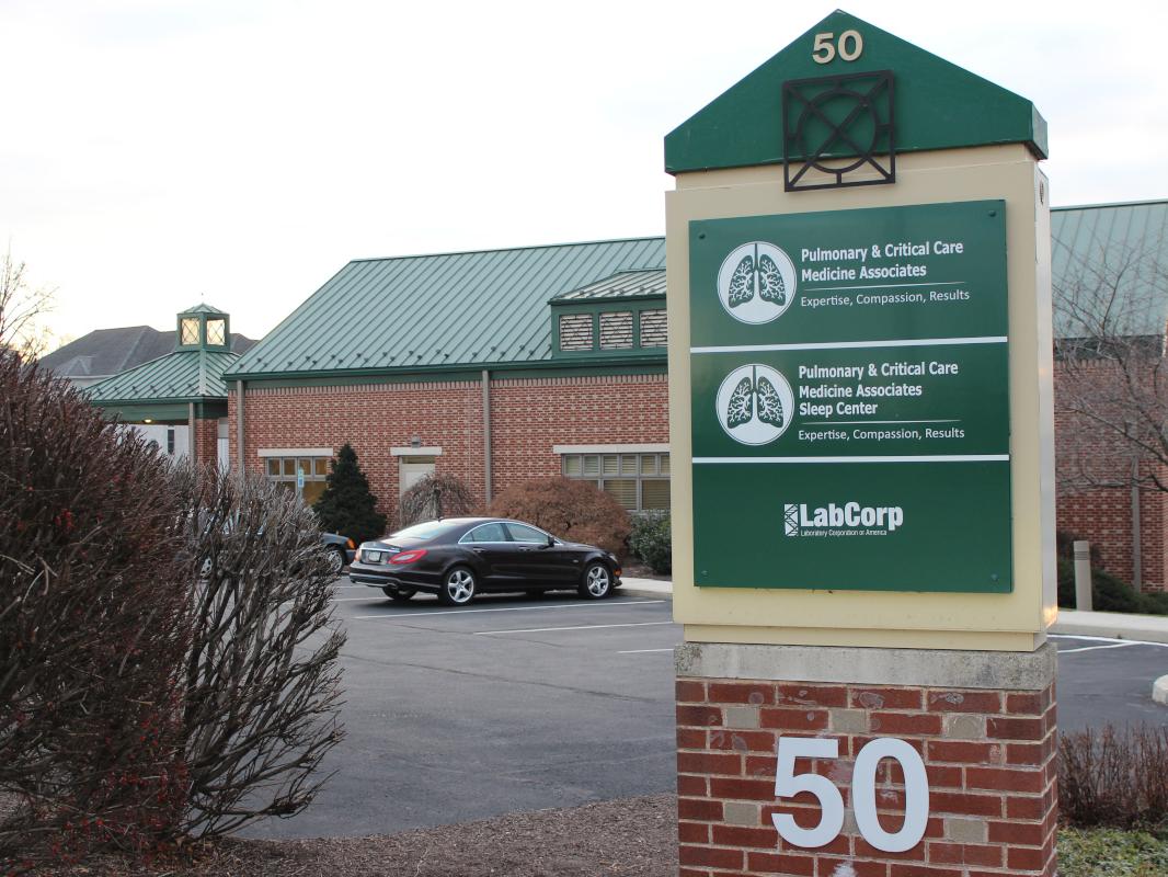 A sign in front of a medical office building