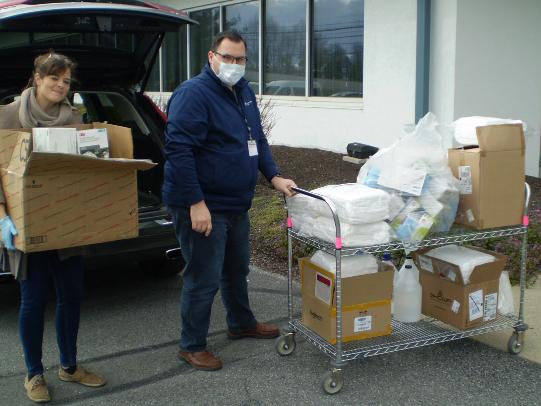 Lisa Weaver transferring a large donation of medical supplies.