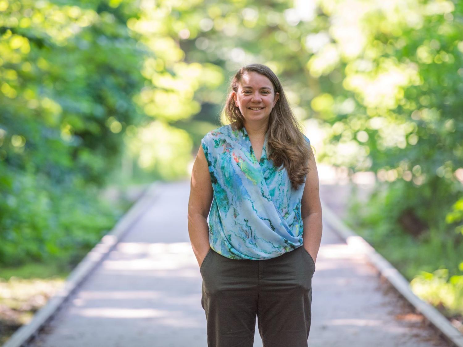 Sam Mason, the sustainability coordinator at Penn State Behrend, stands on a boardwalk in Wintergreen Gorge.