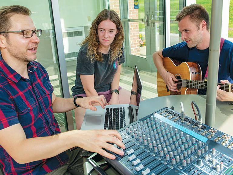 A Penn State Behrend professor and two students record music for a new praise album.