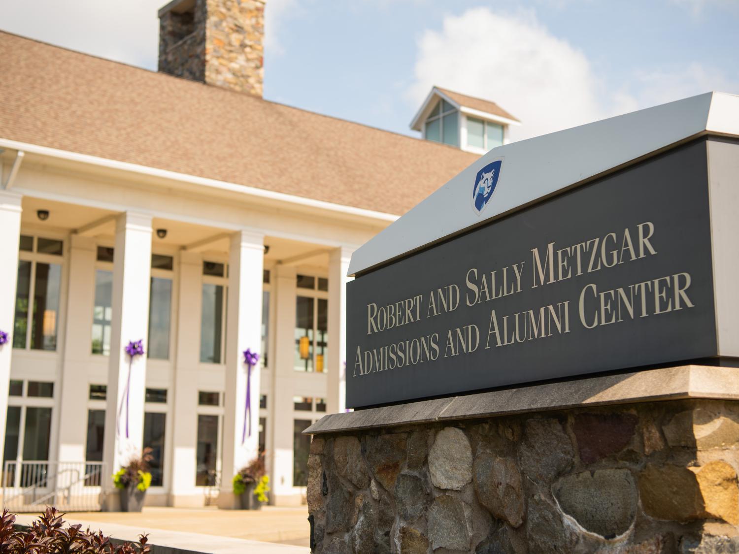 Purple ribbons hang on the pillars of Penn State Behrend's Metzgar Center