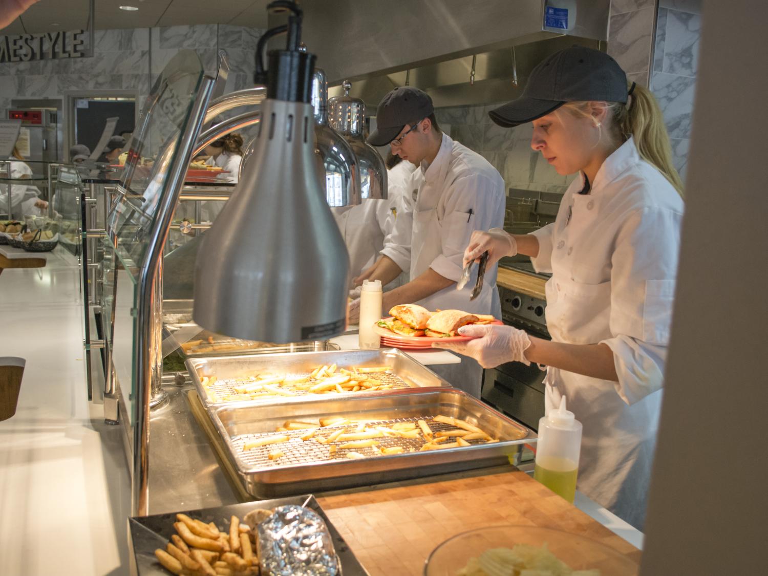 Students preparing food at Cafe Laura