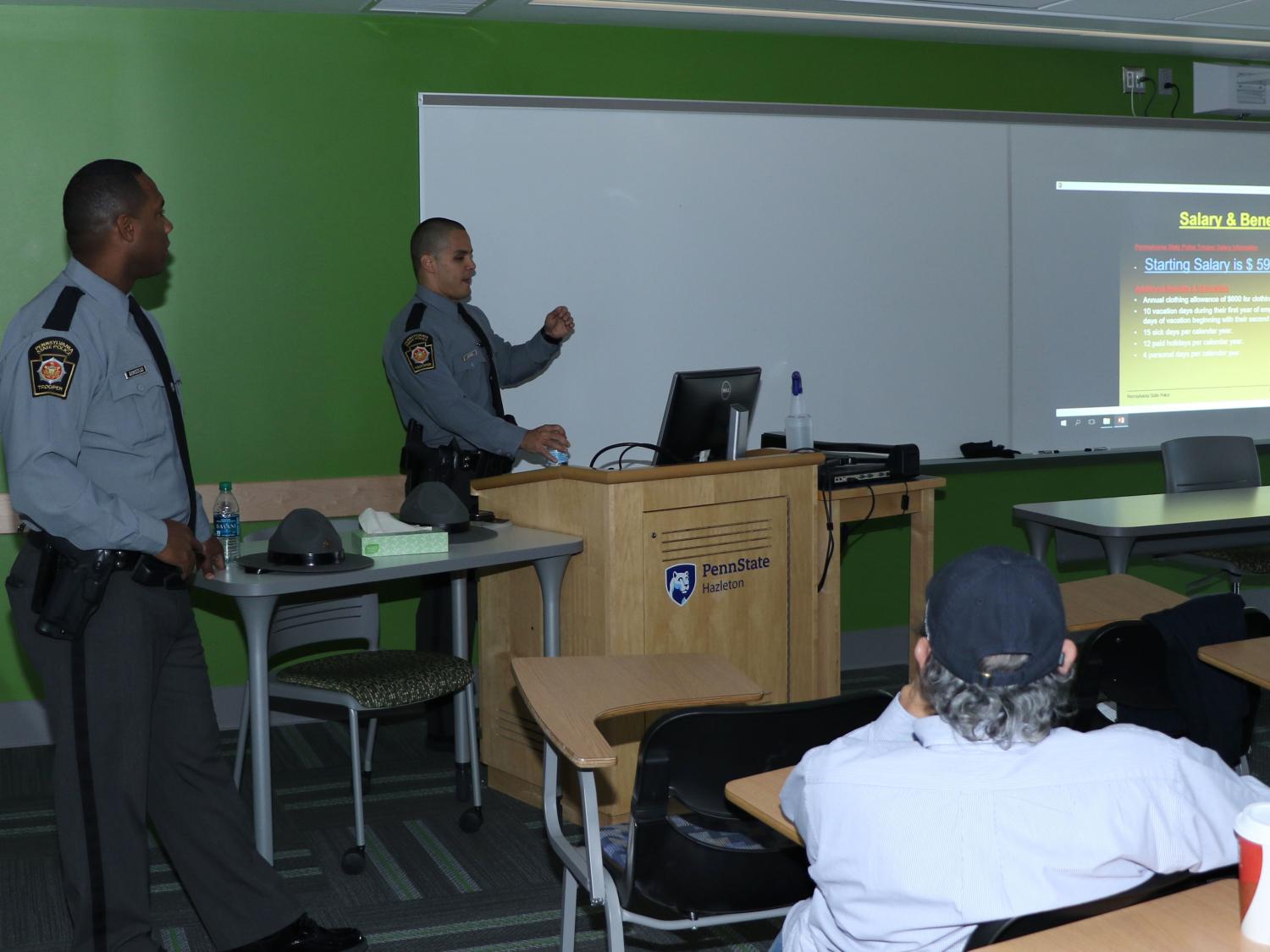 Trooper Marvin Armistead, left, and Trooper David Myers address Daniel Gutierrez’ “Policing in America” class at Penn State Hazleton.