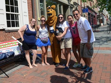 Group of alumni and students with nittany lion