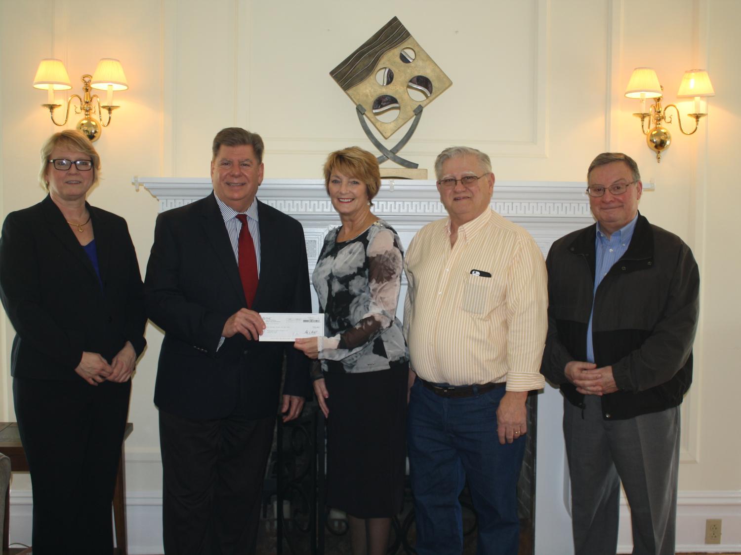 Left to right, Penn State DuBois Director of Development Jean Wolf and Chancellor M. Scott McBride accepting a gift from Trustees for the A.J. and Sigismunda Palumbo Charitable Trust, Joe Palumbo, Karin Pfingstler, and Bob Ordiway.