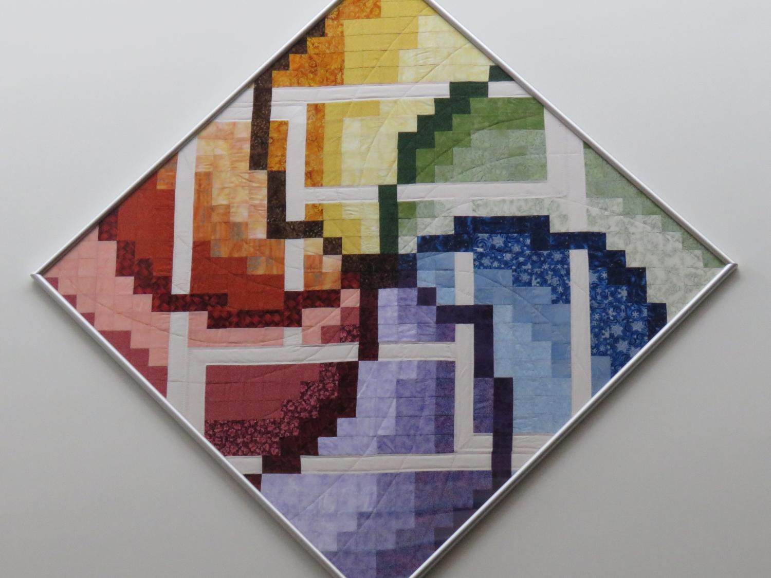 A close-up of a quilt that hangs in the School of Science at Penn State Behrend.