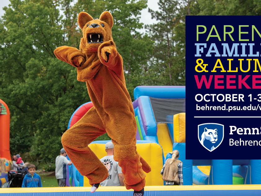 The Nittany Lion jumps on an inflatable during an event at Penn State Behrend.