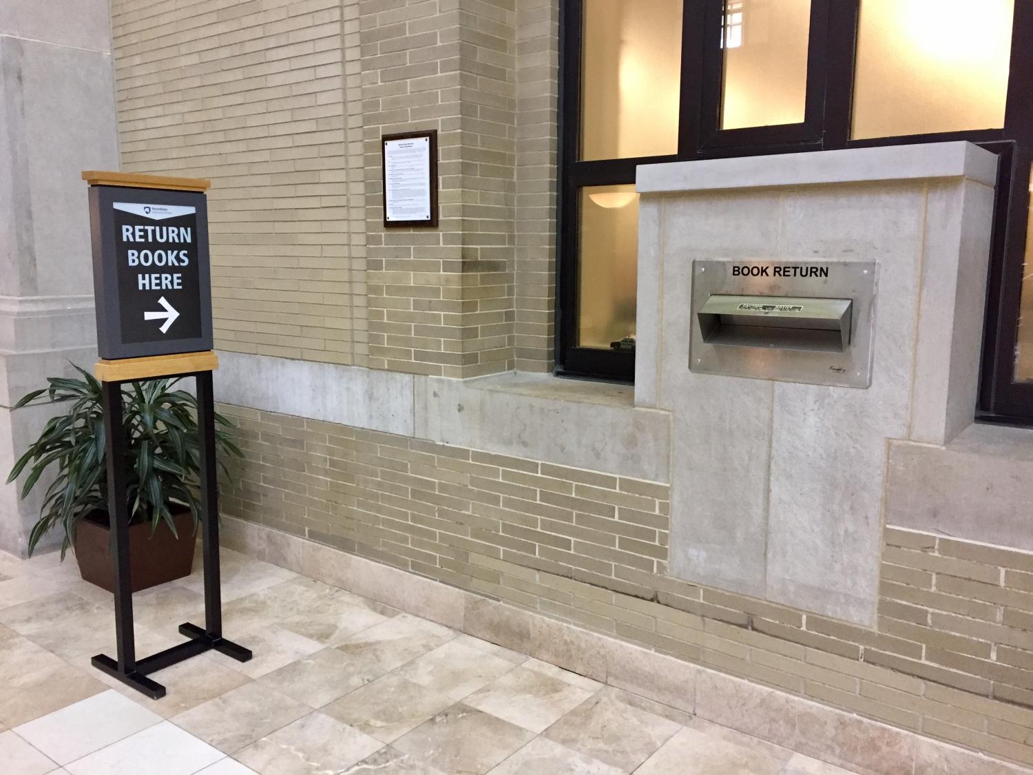 interior photo Pattee Library book return slot and sign,
