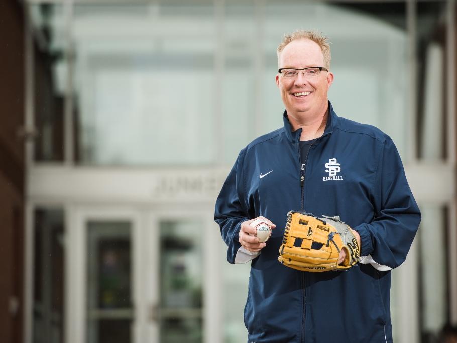 Penn State Behrend baseball coach Paul Benim stands outside the college's Junker Center.