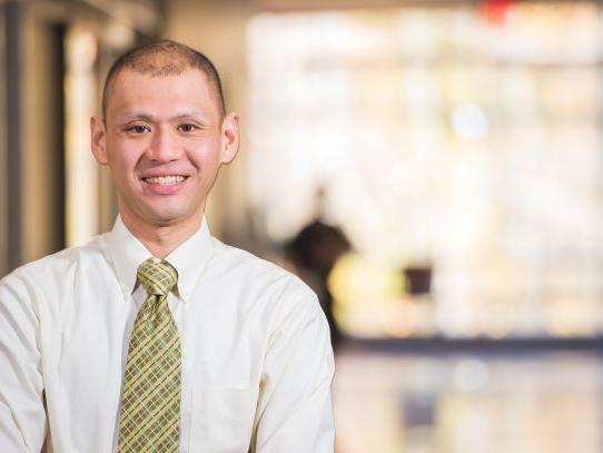 A professor stands in Burke Center at Penn State Behrend.