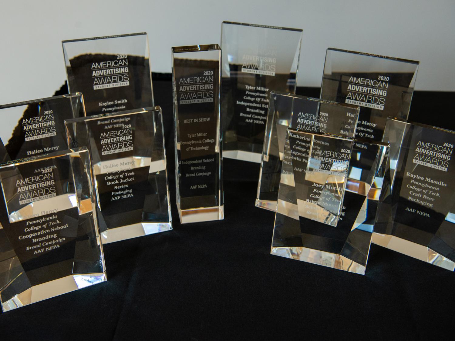 Penn College trophies for graphic design sitting on a table