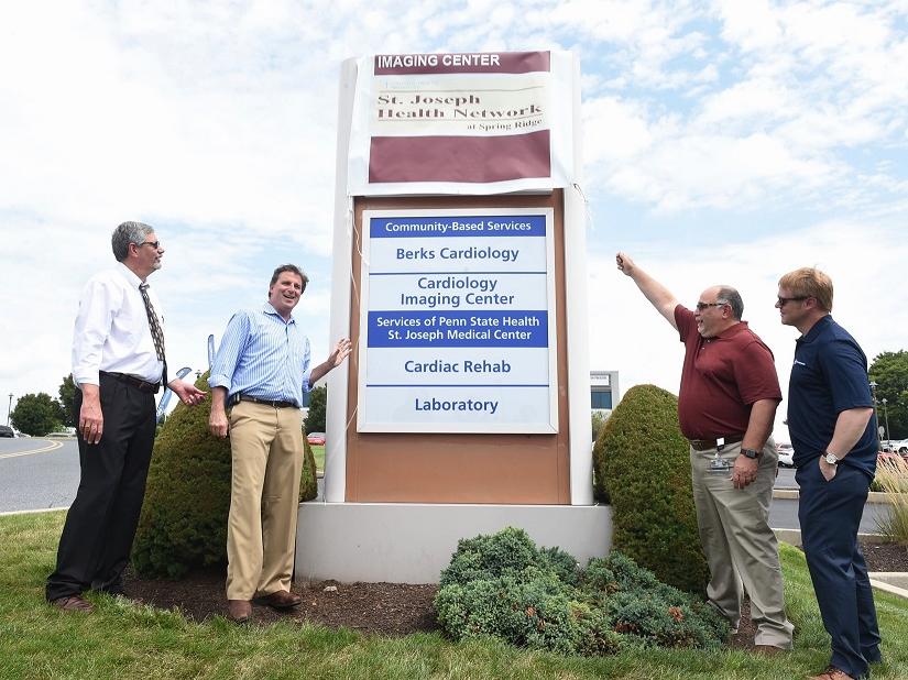 The new sign at Penn State Health Medical Group - Berks Cardiology in Wyomissing is unveiled on Aug. 8, 2018.