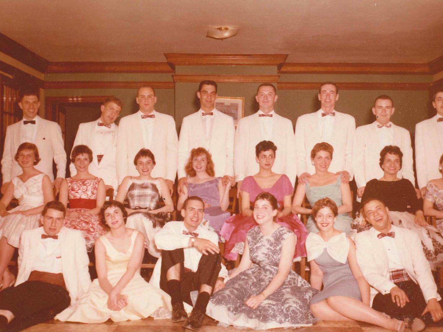The brothers of Phi Sigma Delta pose with their dates before a formal dance in the 1950s.