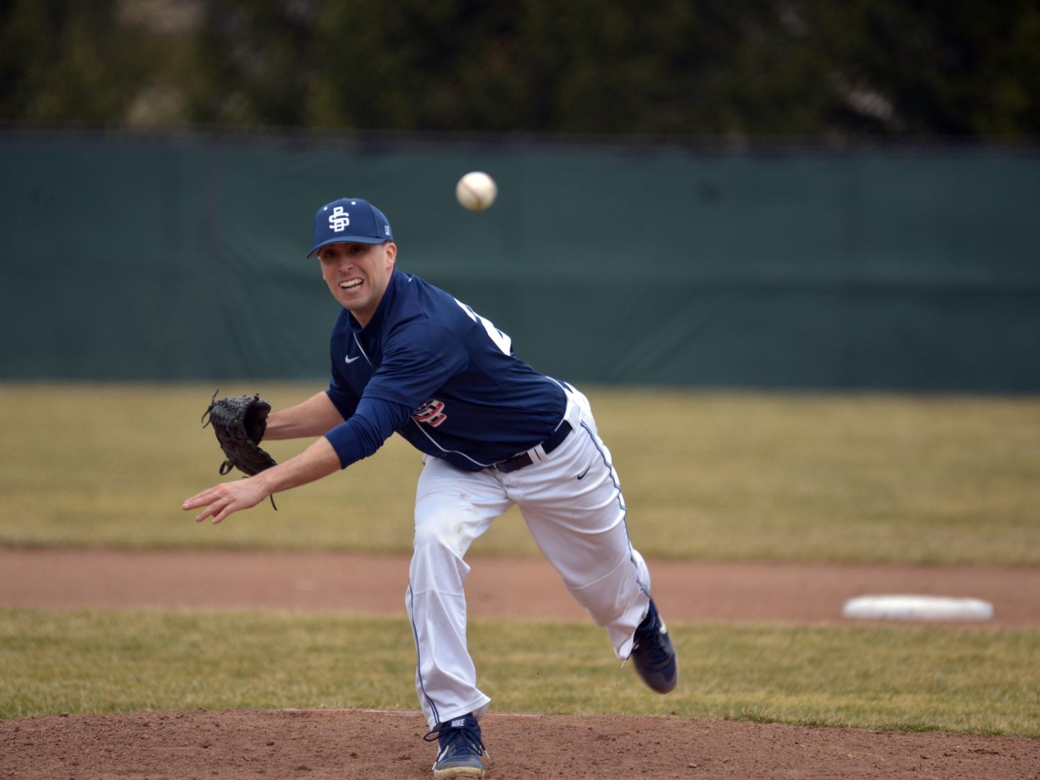 Penn State Behrend baseball player Phil Myers pitches during a game.