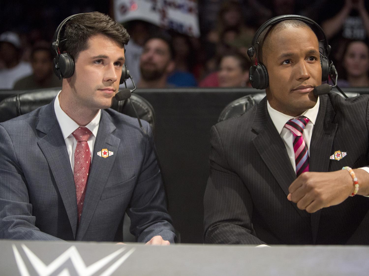 Tom Hannifan at WWE desk with Byron Saxton