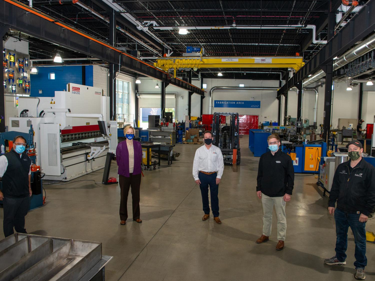 Visitors at the Philadelphia Shipyard touring the welding facilities