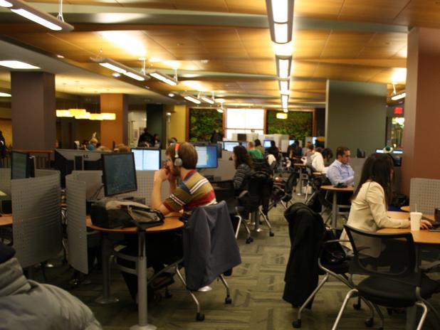 Students sitting and working at computers in a computer lab