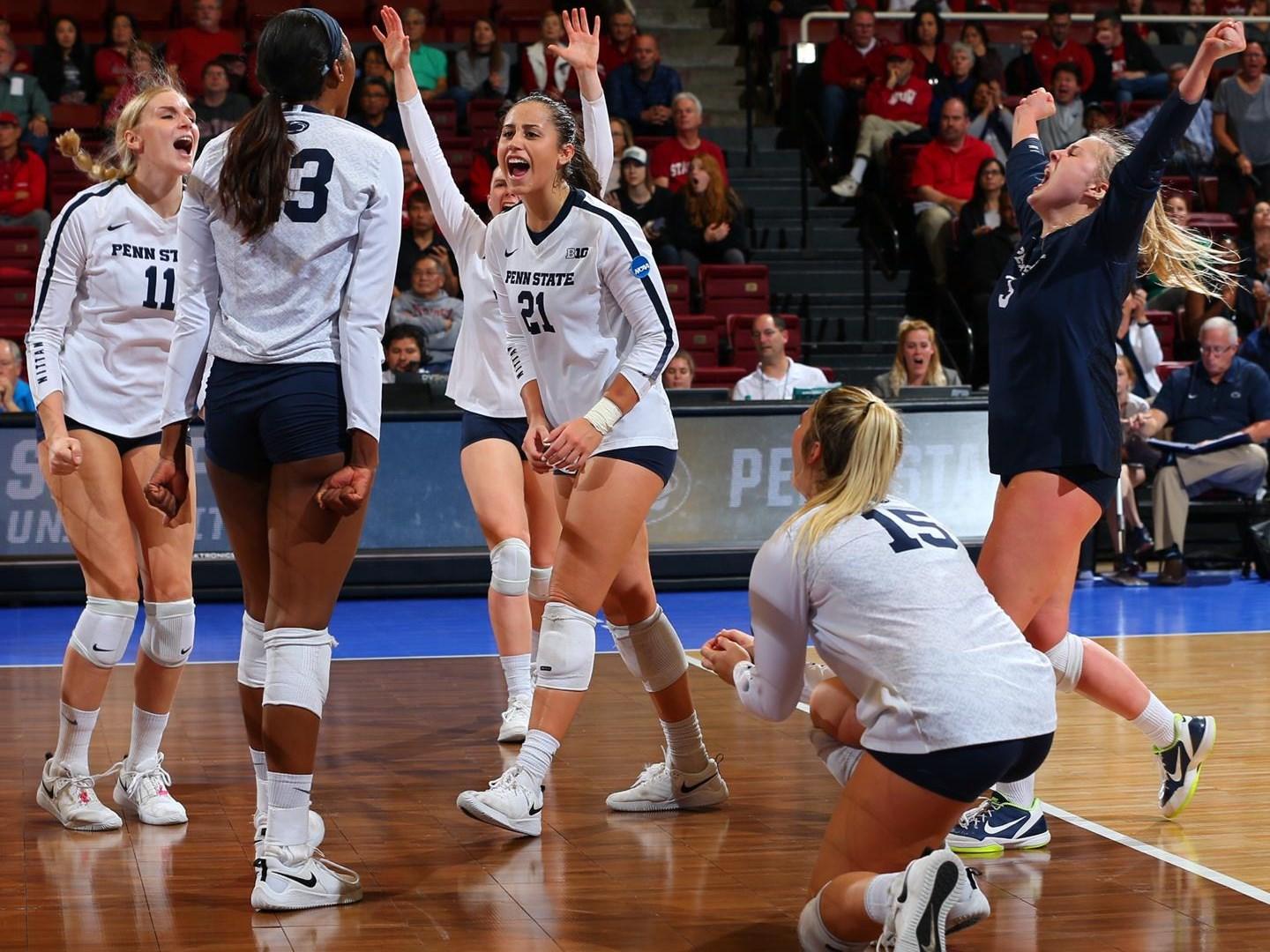 Penn State women's volleyball players on a court