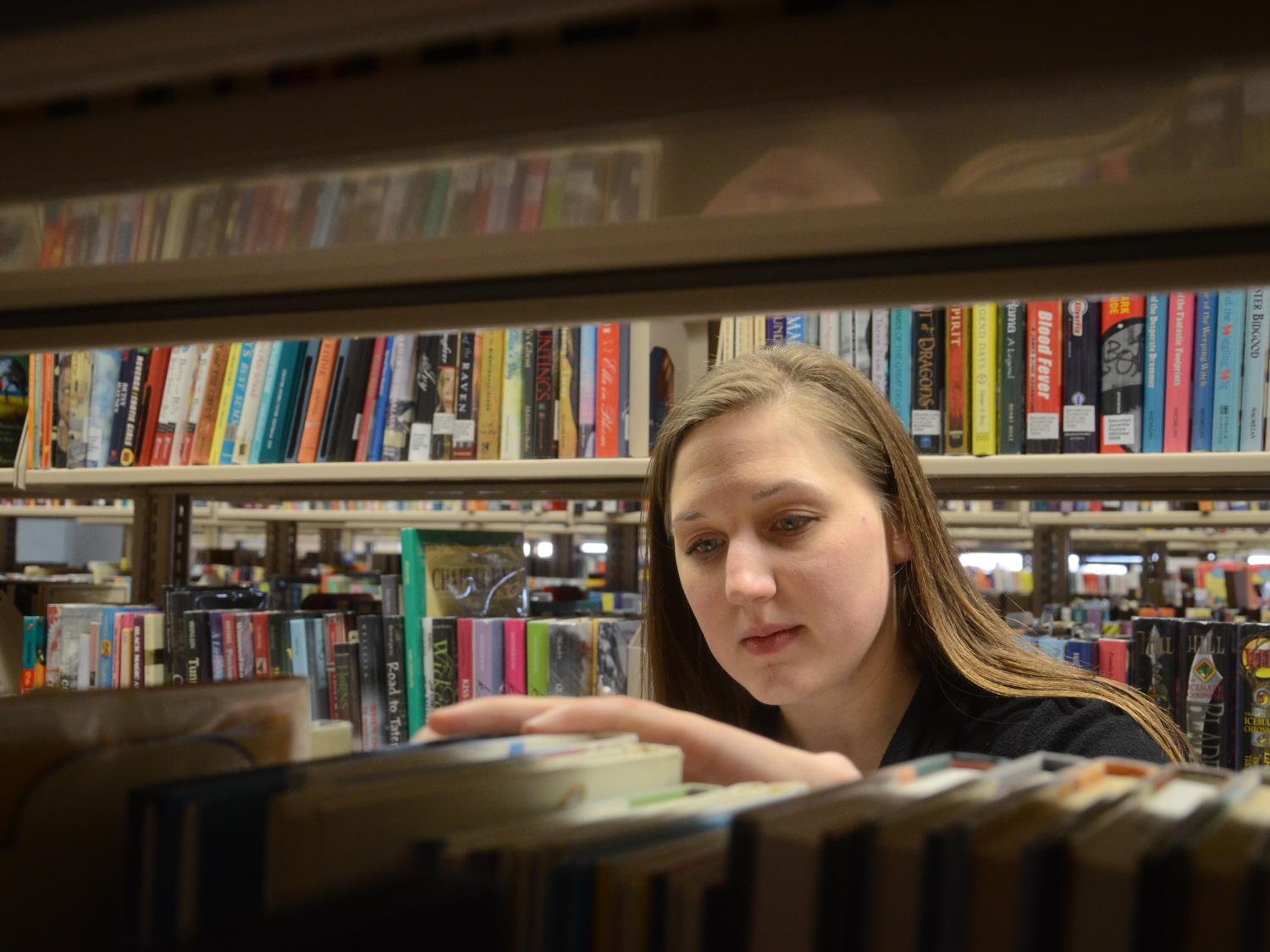 Searching through books at the library