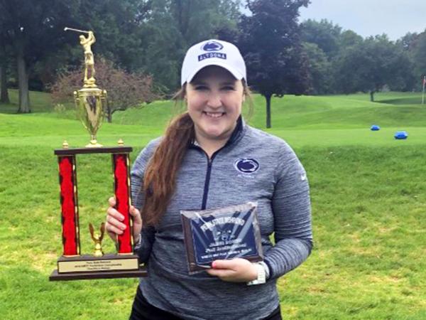 Katie Pupillo poses with her championship trophy and award