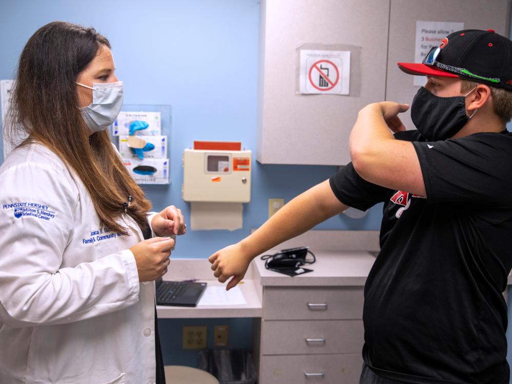 Dr. Jessica Butts discusses injuries with patient Joshua Hicklin at Penn State Health Medical Group - Nyes Road.