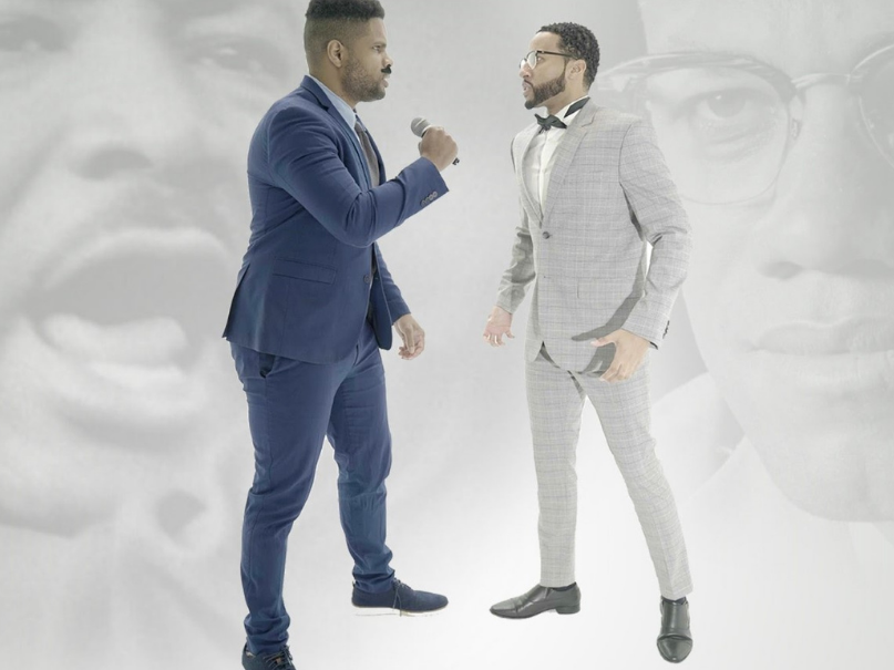 Image of two men engaging in a rap battle