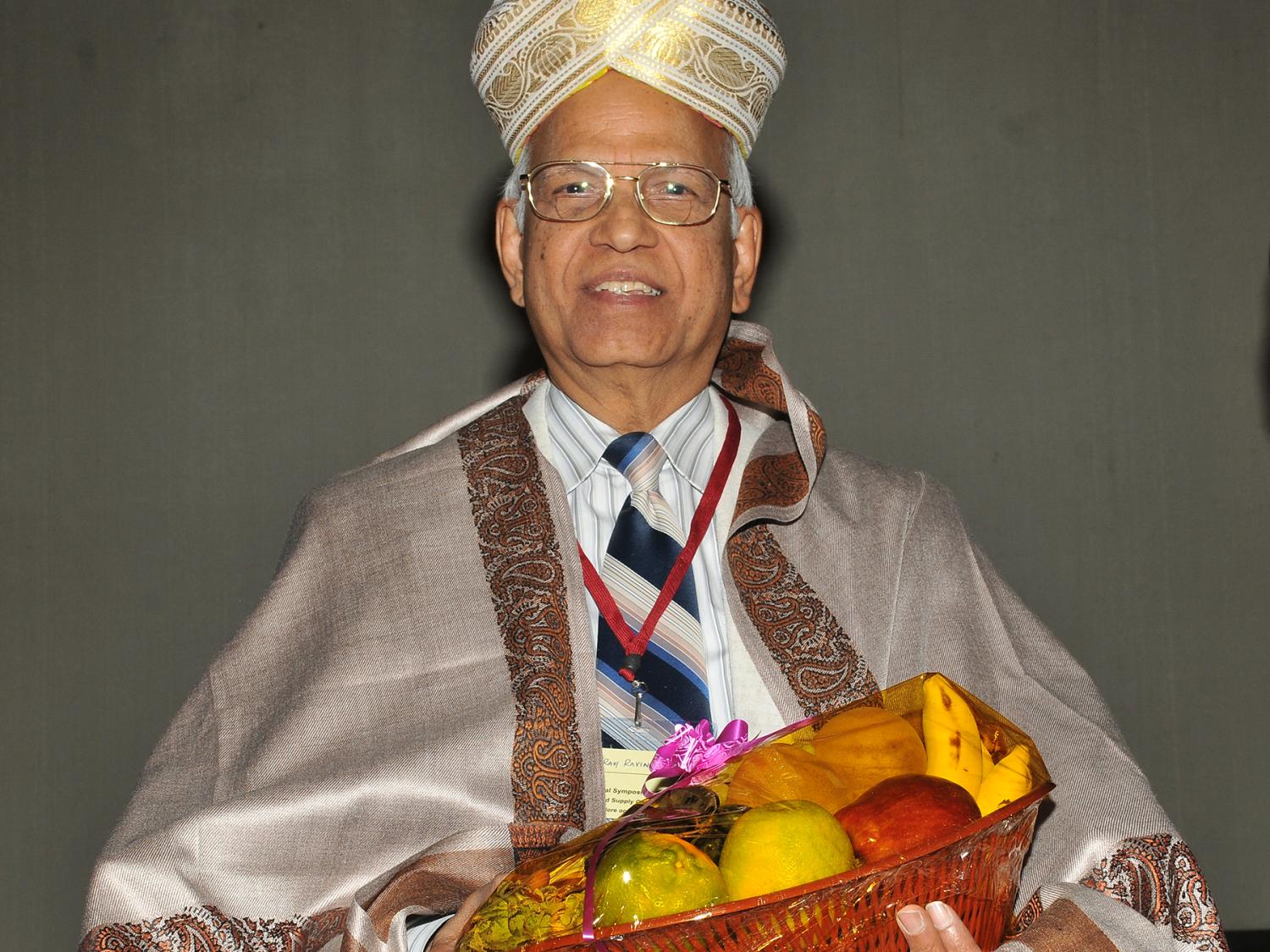 Ravindran being welcomed at his symposium
