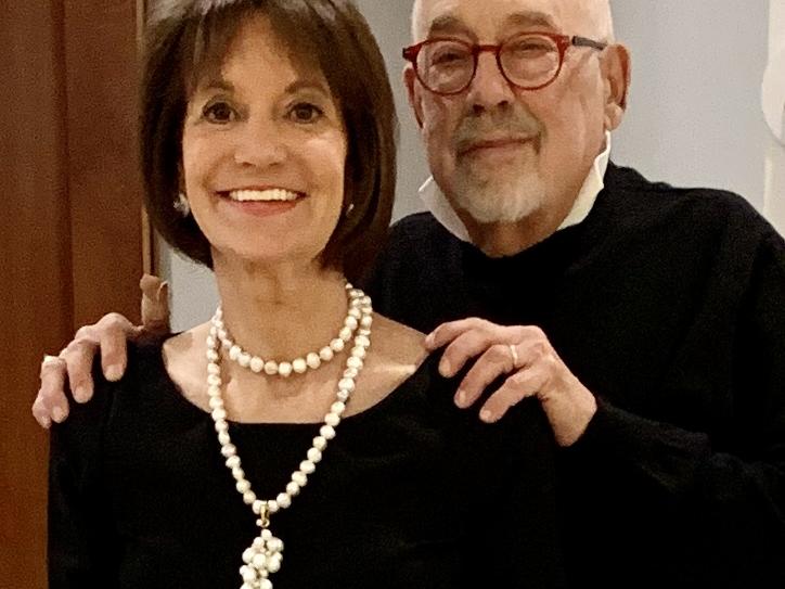 Rhea Schwartz is pictured with Paul Wolff standing behind her, hands on her shoulders 
