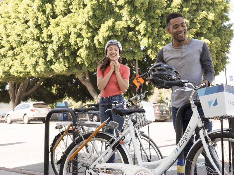 Students getting ready to ride a Zagster bike