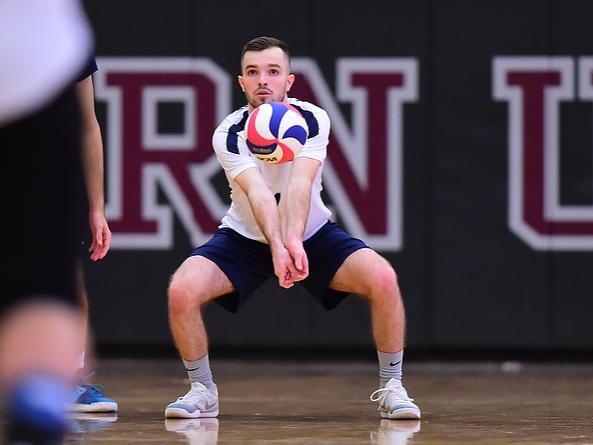 Penn State Behrend volleyball player Robert McMaster prepares to hit the ball