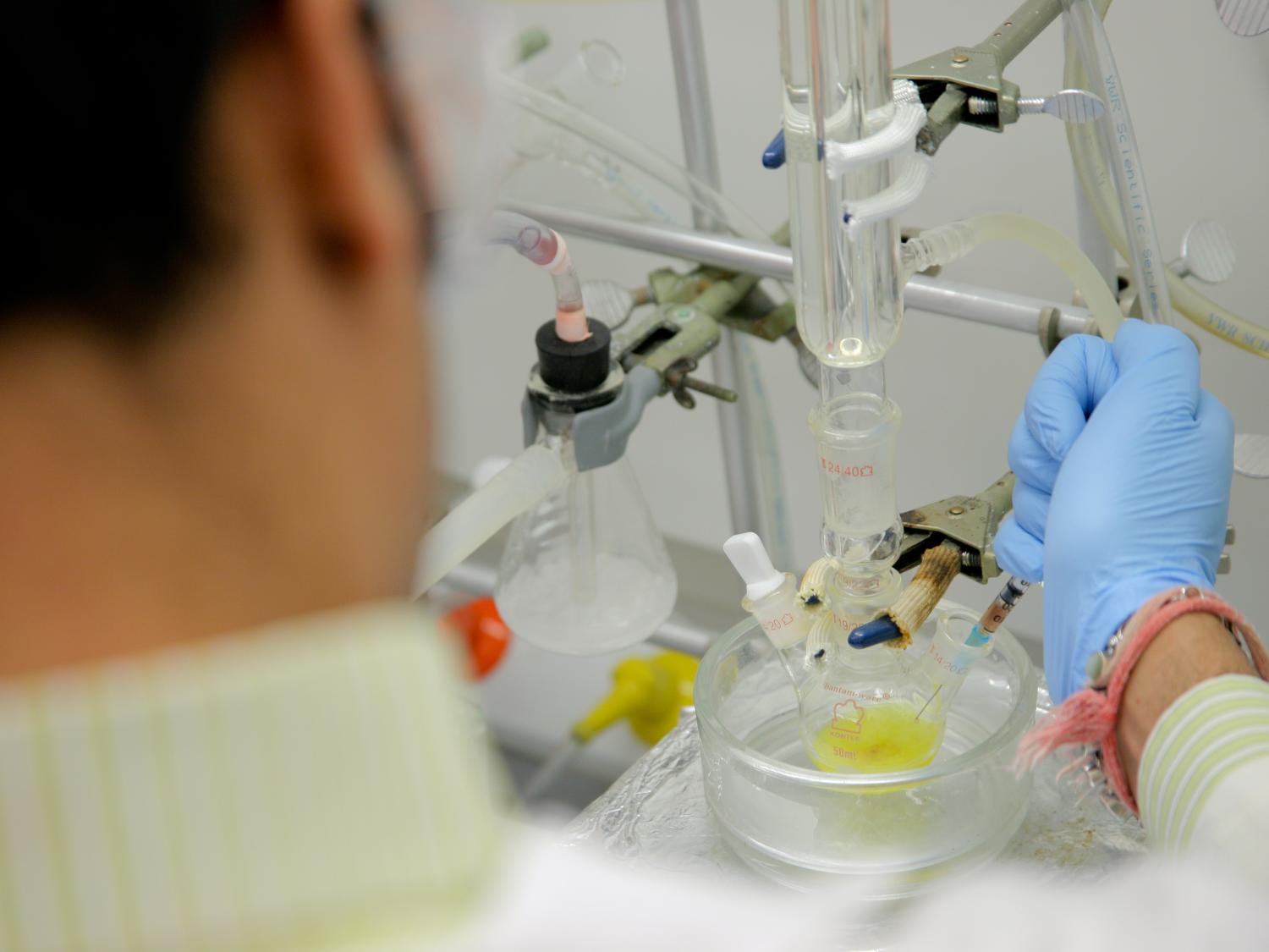 lab worker with blue glove
