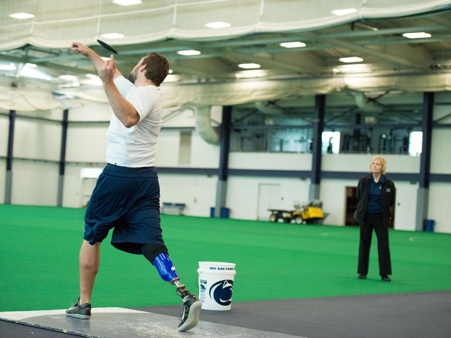 Max Rohn throws the discus at Penn State's indoor track and field facility