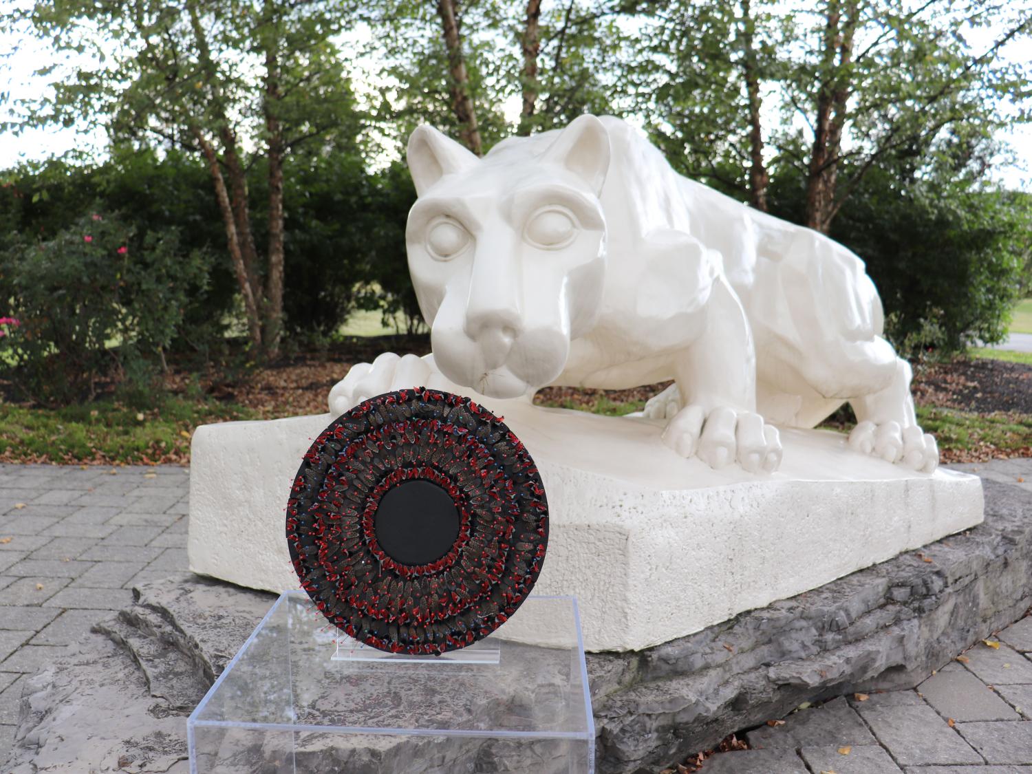 Nittany Lion Shrine with spotted lanterfly artwork in front of it