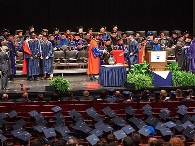 Panoramic shot of the Eisenhower Auditorium stage and first rows during the Schreyer Honors College Medals Ceremony